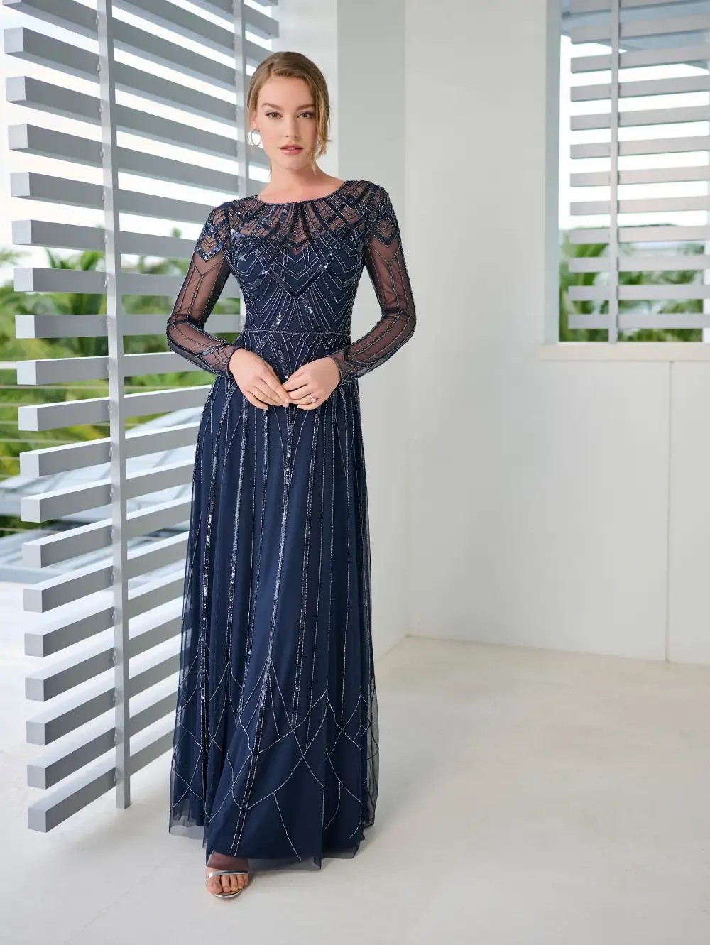 Model wearing a green gown