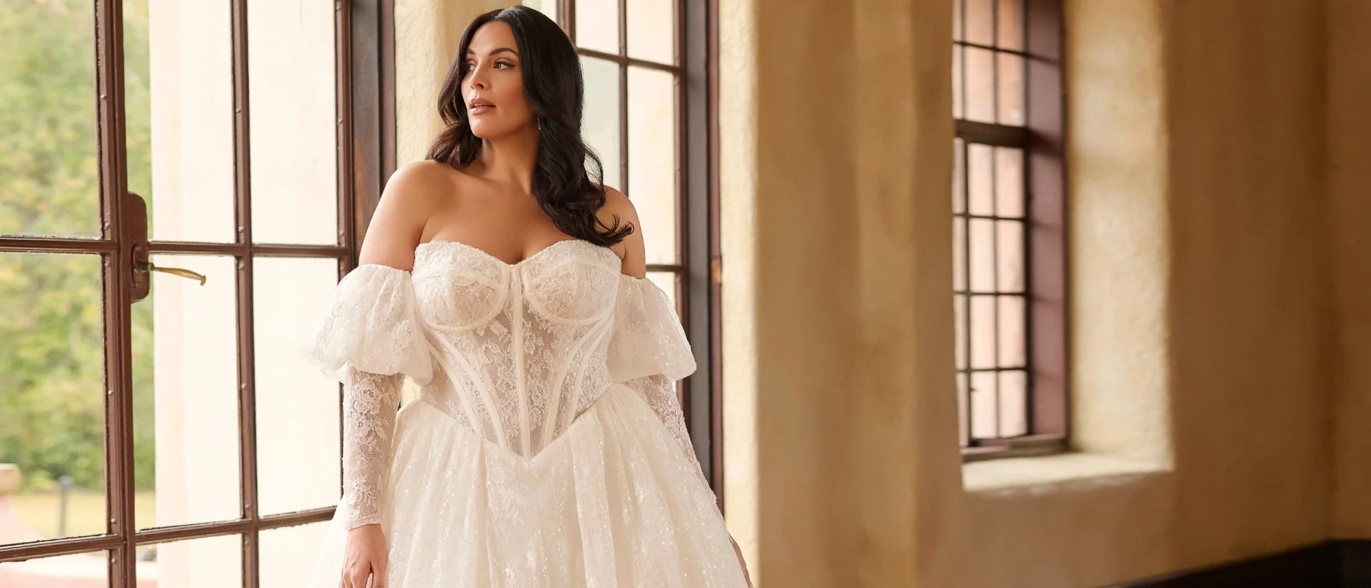 Model wearing a white gown