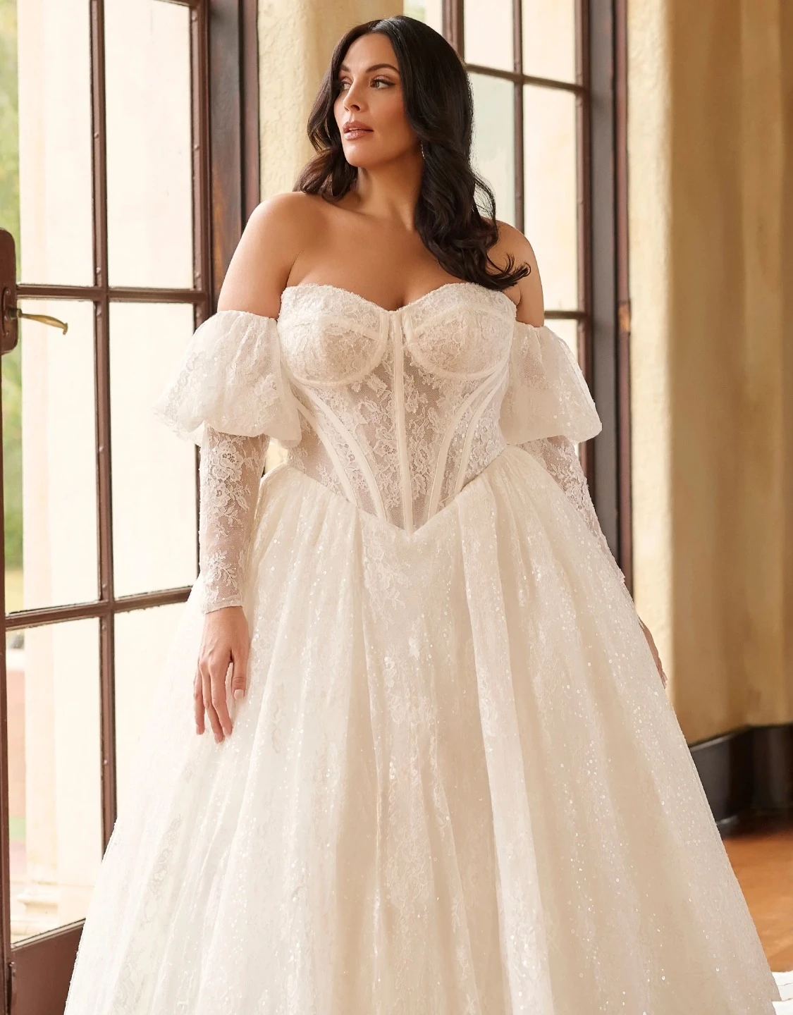 Model wearing a white gown. Mobile image