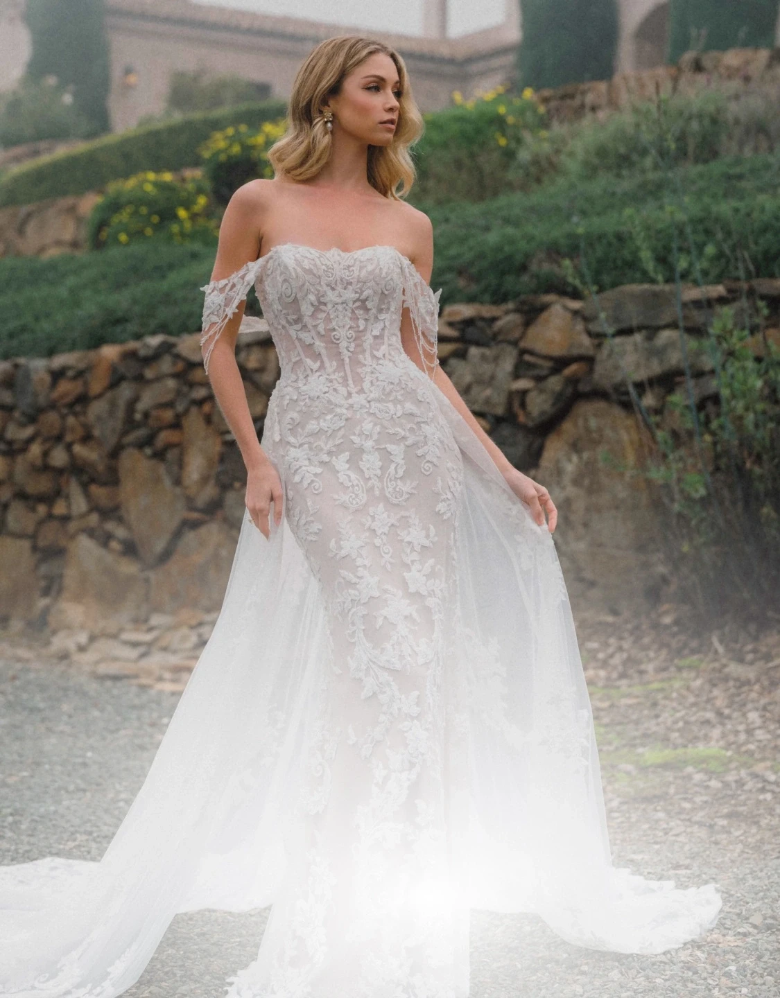 Model wearing a white gown. Mobile image