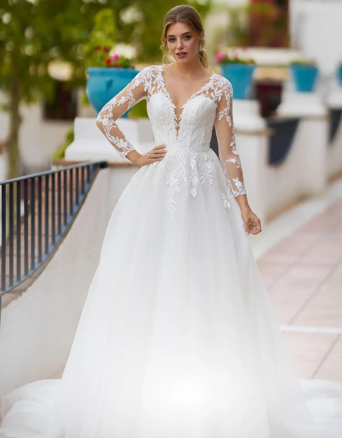 Model wearing a white gown. Mobile image