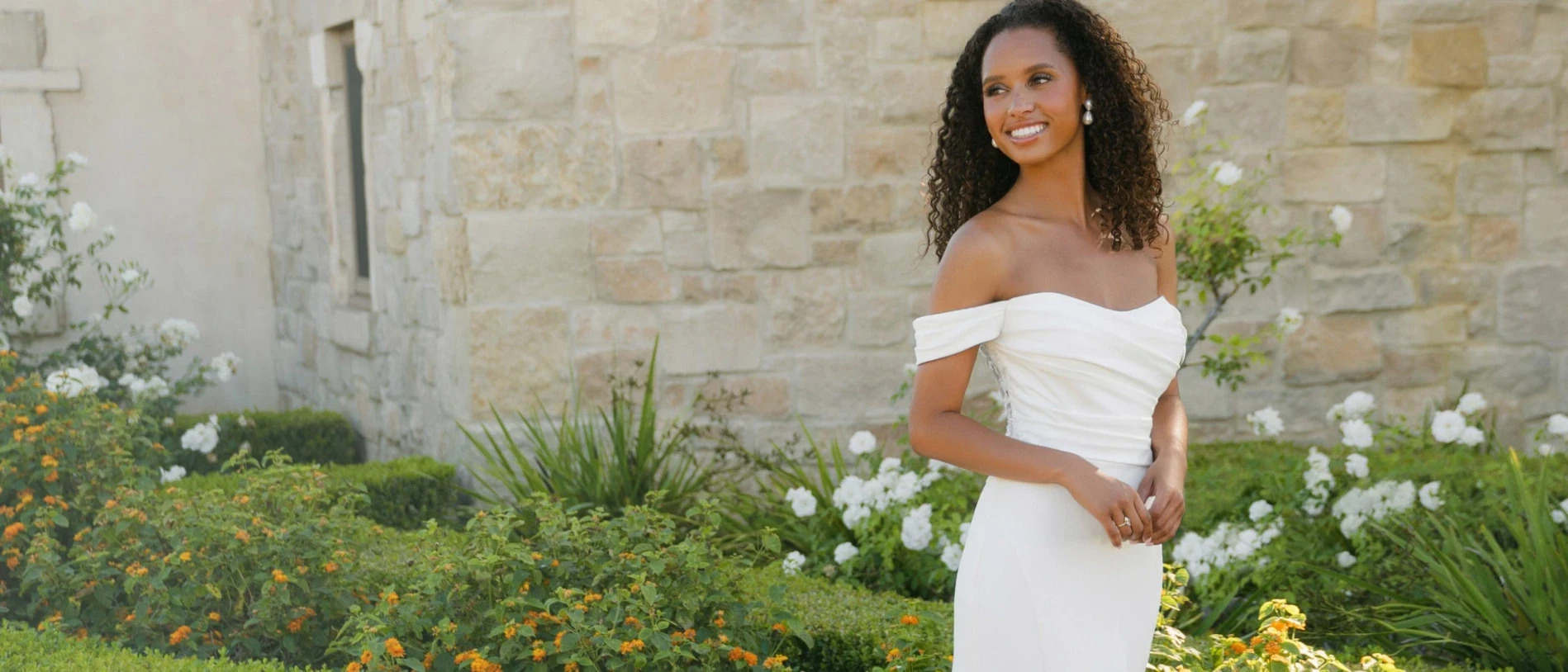 Model wearing a white gown
