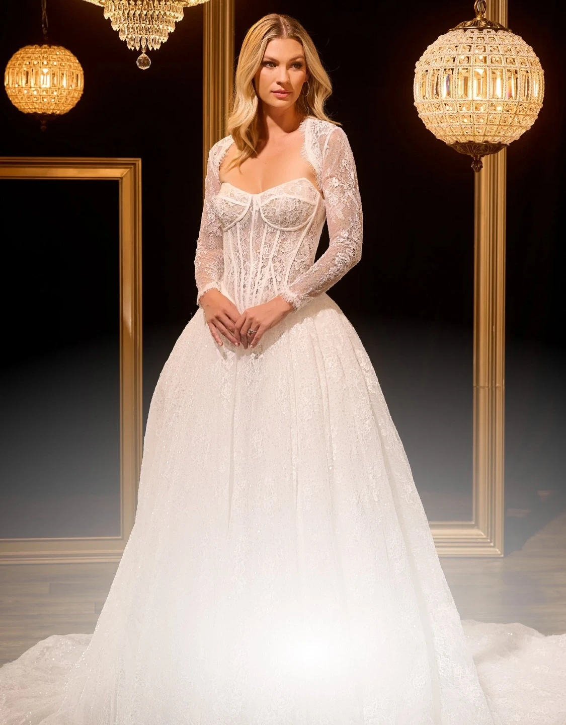 Model wearing a white gown. Mobile image